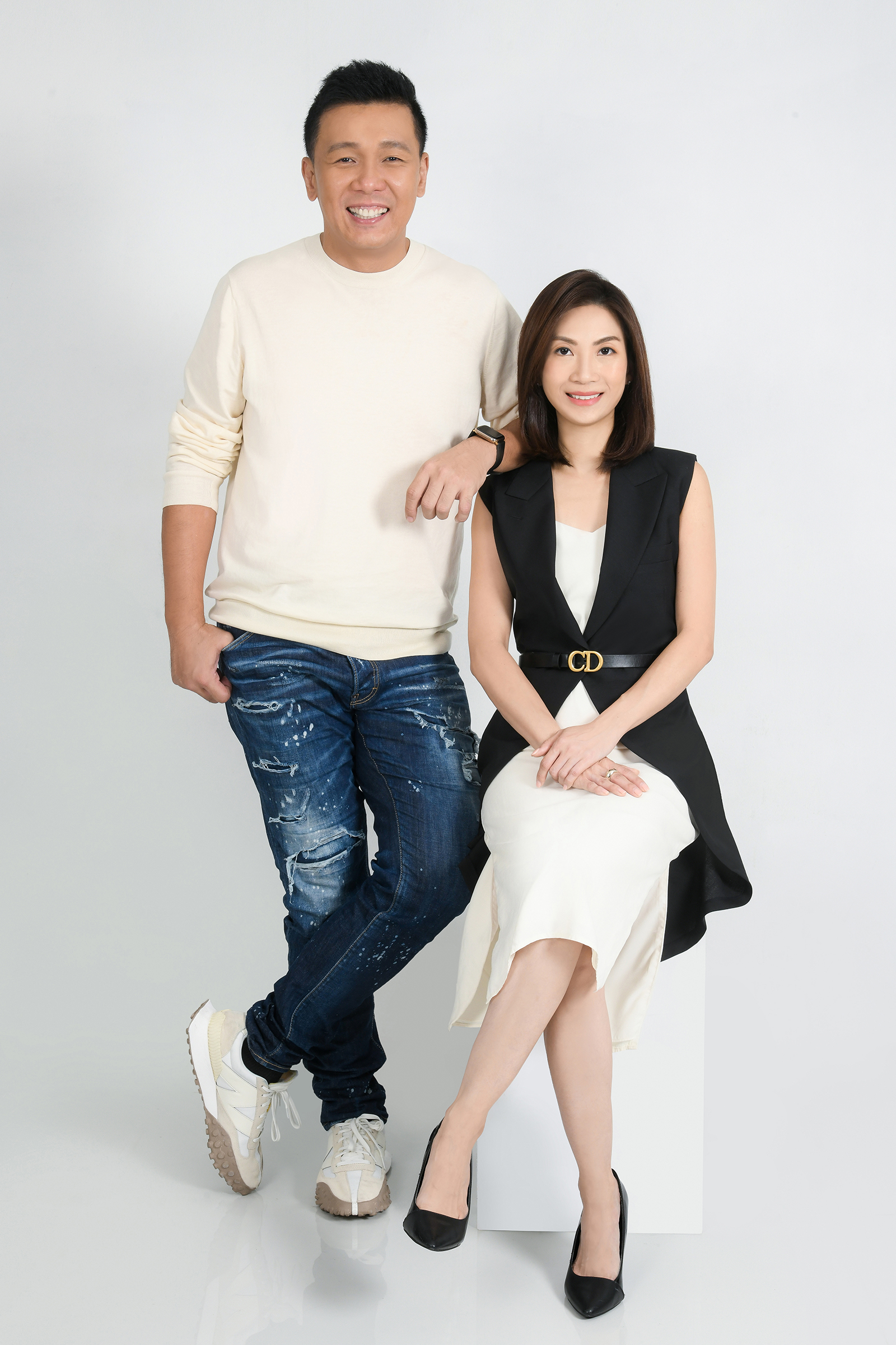 Leon Chua and Lynette Cher smiling together in a studio portrait